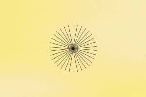A graphic of a black starburst design centered on a pale yellow background, featuring numerous thin lines radiating outward from a central point.
