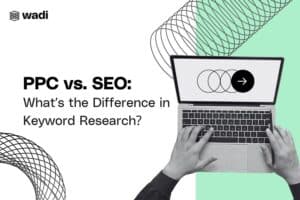 A person typing on a laptop is displayed. The laptop screen shows a Venn diagram with an arrow pointing right. The text reads: "PPC vs. SEO: What’s the Difference in Keyword Research?" The wadi logo appears at the top left. Background features abstract wavy lines.
